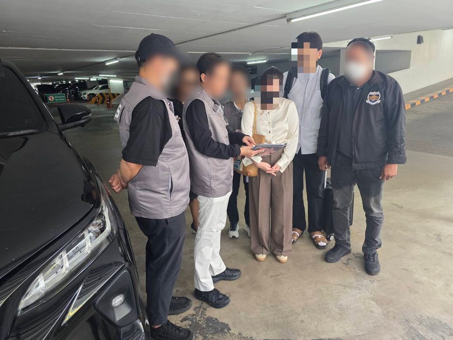 DSI officers at the arrest on 15 July 2026; faces blurred by DSI.